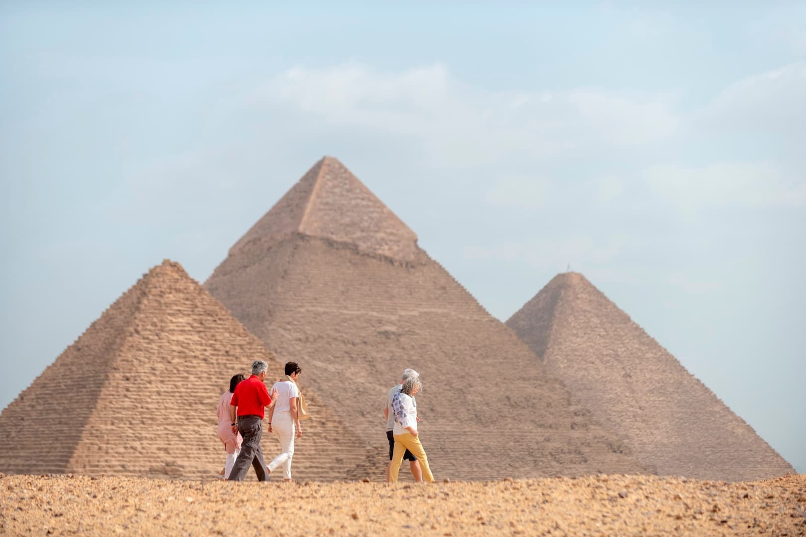 Guests walk among the Pyramids Giza in Egypt