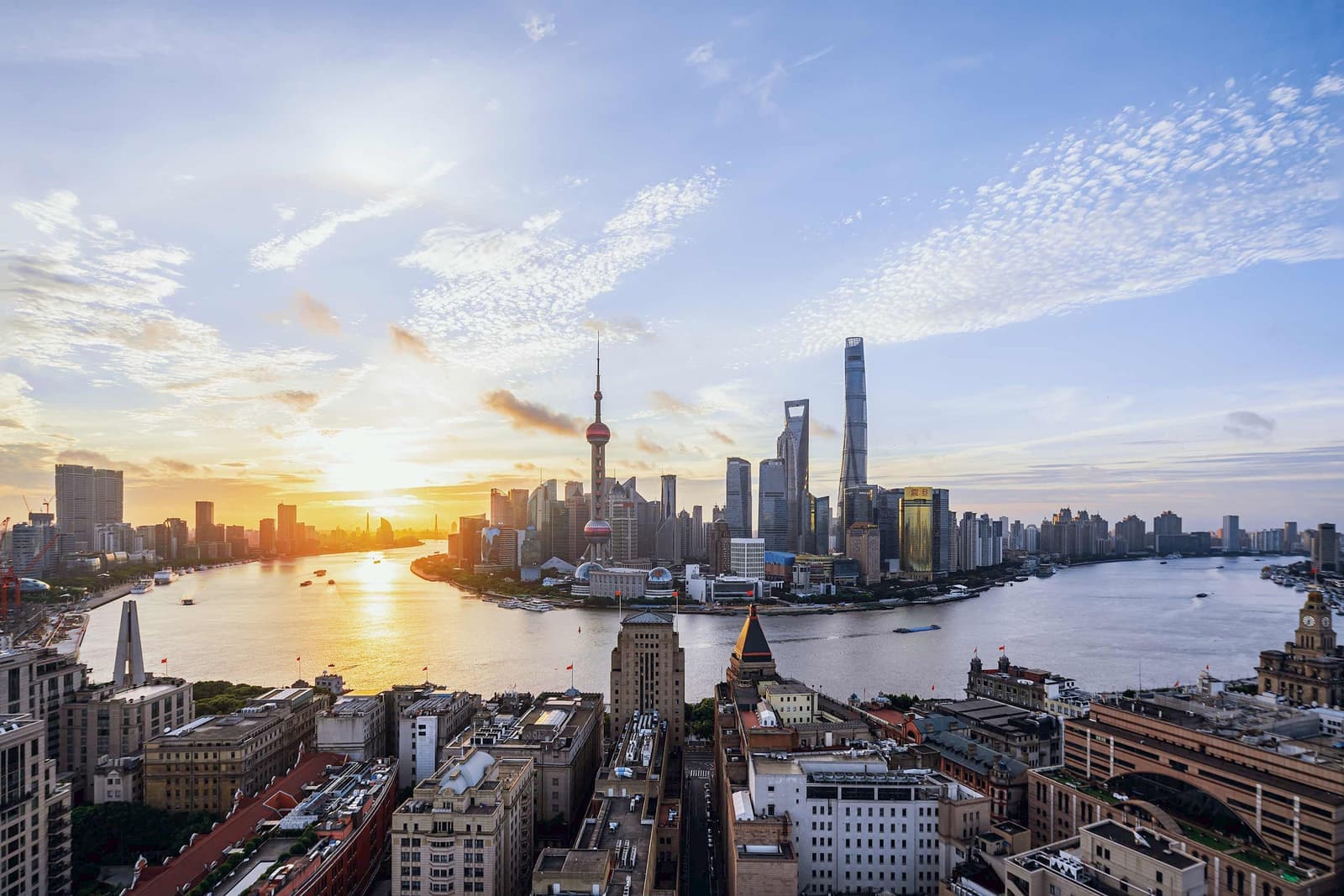Aerial panoramic sun glowing view of Shanghai, China