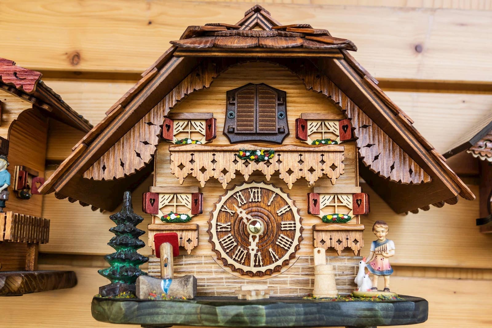 Traditional German cuckoo clock with carvings and figurines