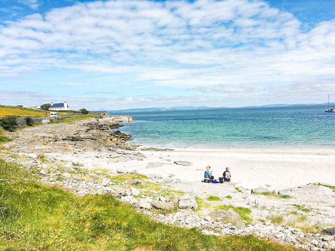 Travellers on the beach on Inishmore on the Aran Islands in Galway, Ireland