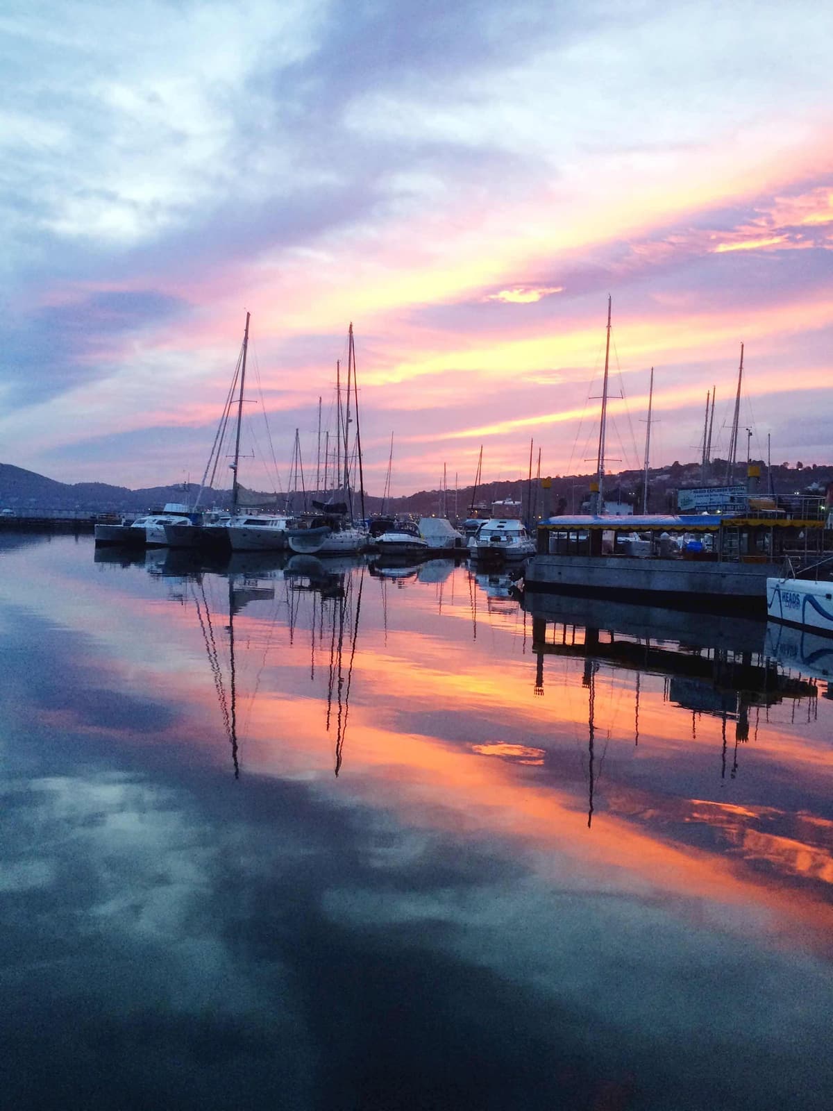 Sailboats moored at sunset in Knysna, Western Cape, South Africa