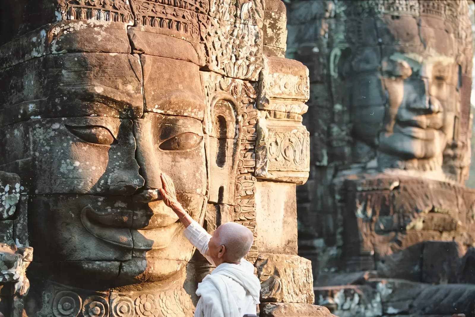 Day Hero Buddhist Nun Touching Stone Sculptures, Siem Reap, Cambodia