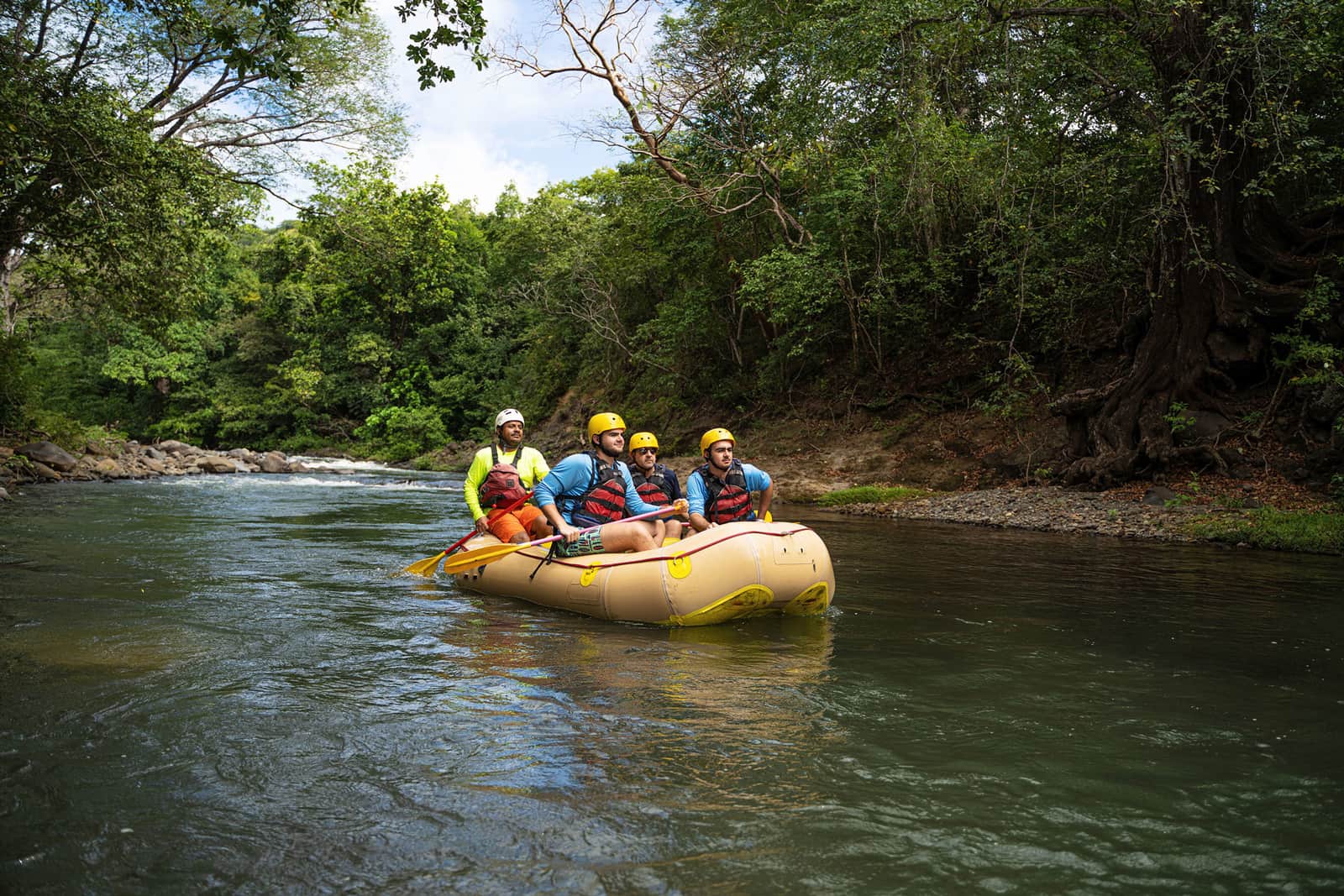 A group of people white water rafting in Lake Arenal, Costa Rica