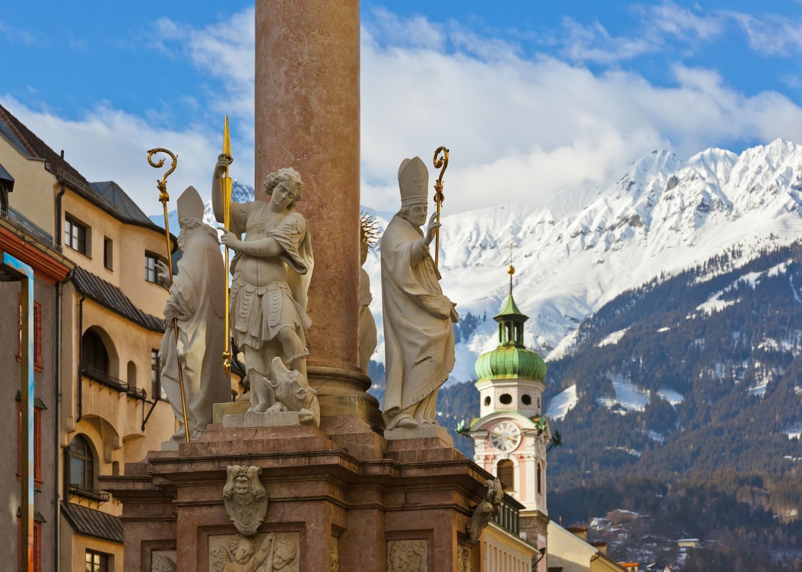 Historic sculptures and a clock tower in Innsbruck, Austria