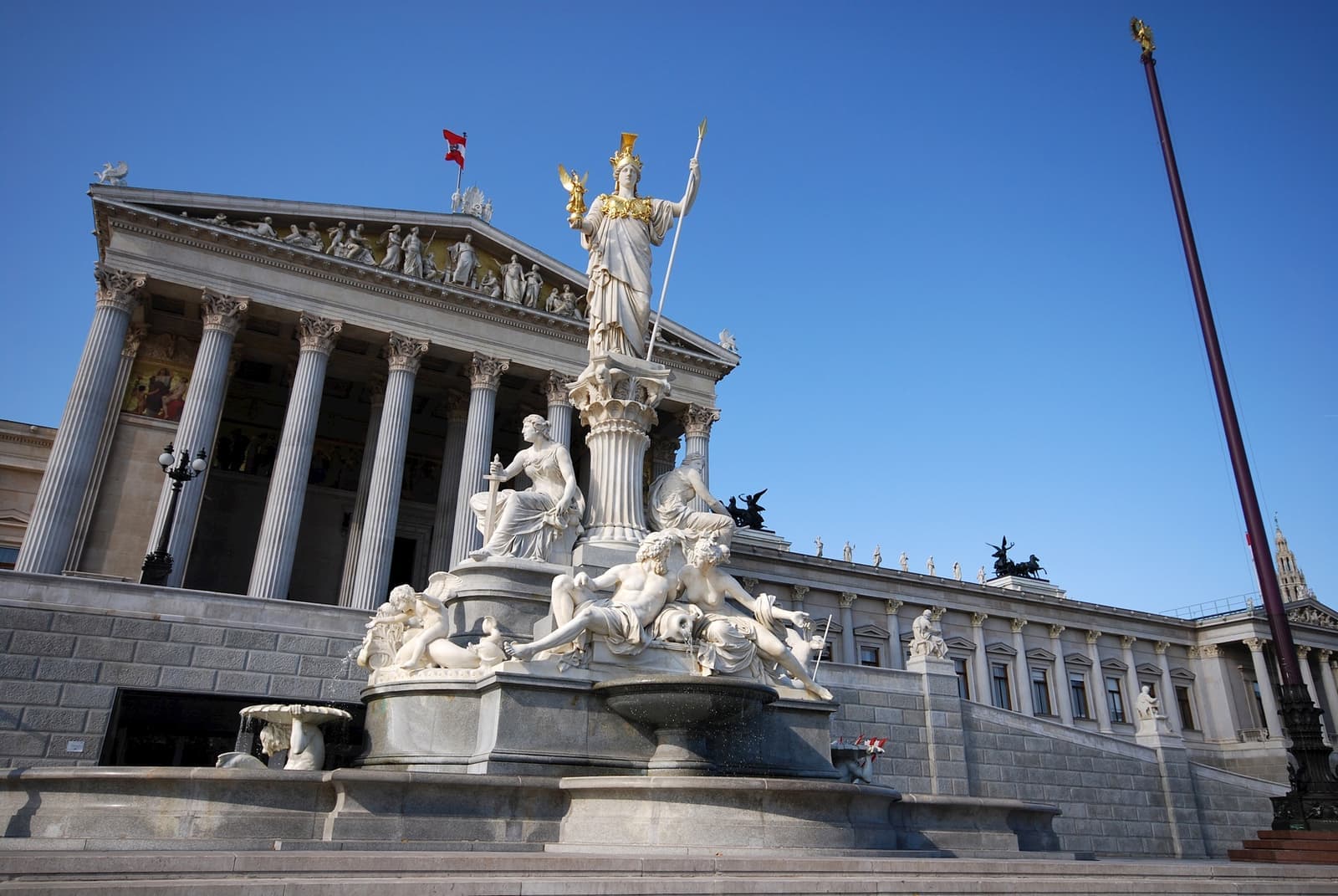 A historic, detailed building and statues in Vienna, Austria