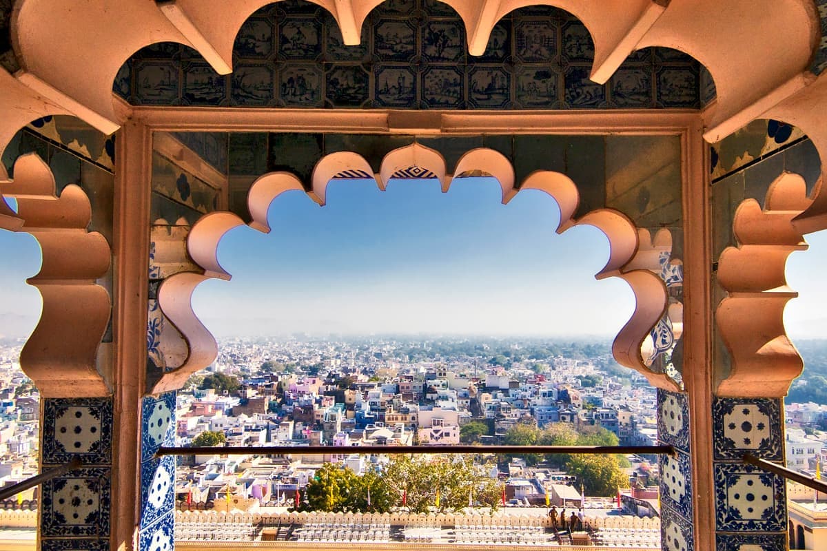 Sunny day view through City Palace windows overlooking Udaipur, Rajasthan, India