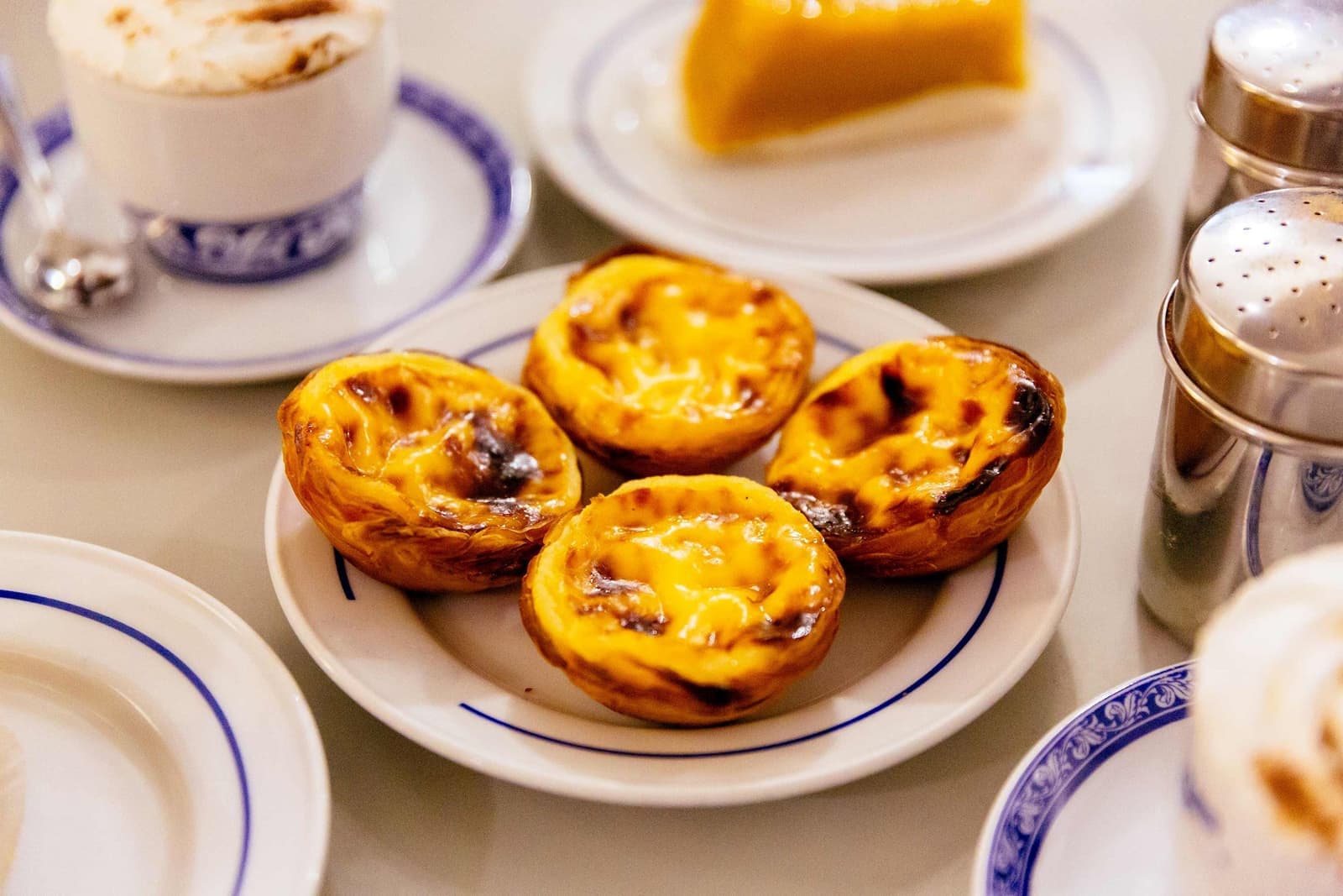 A plate of four Portuguese Pasteis de Belém