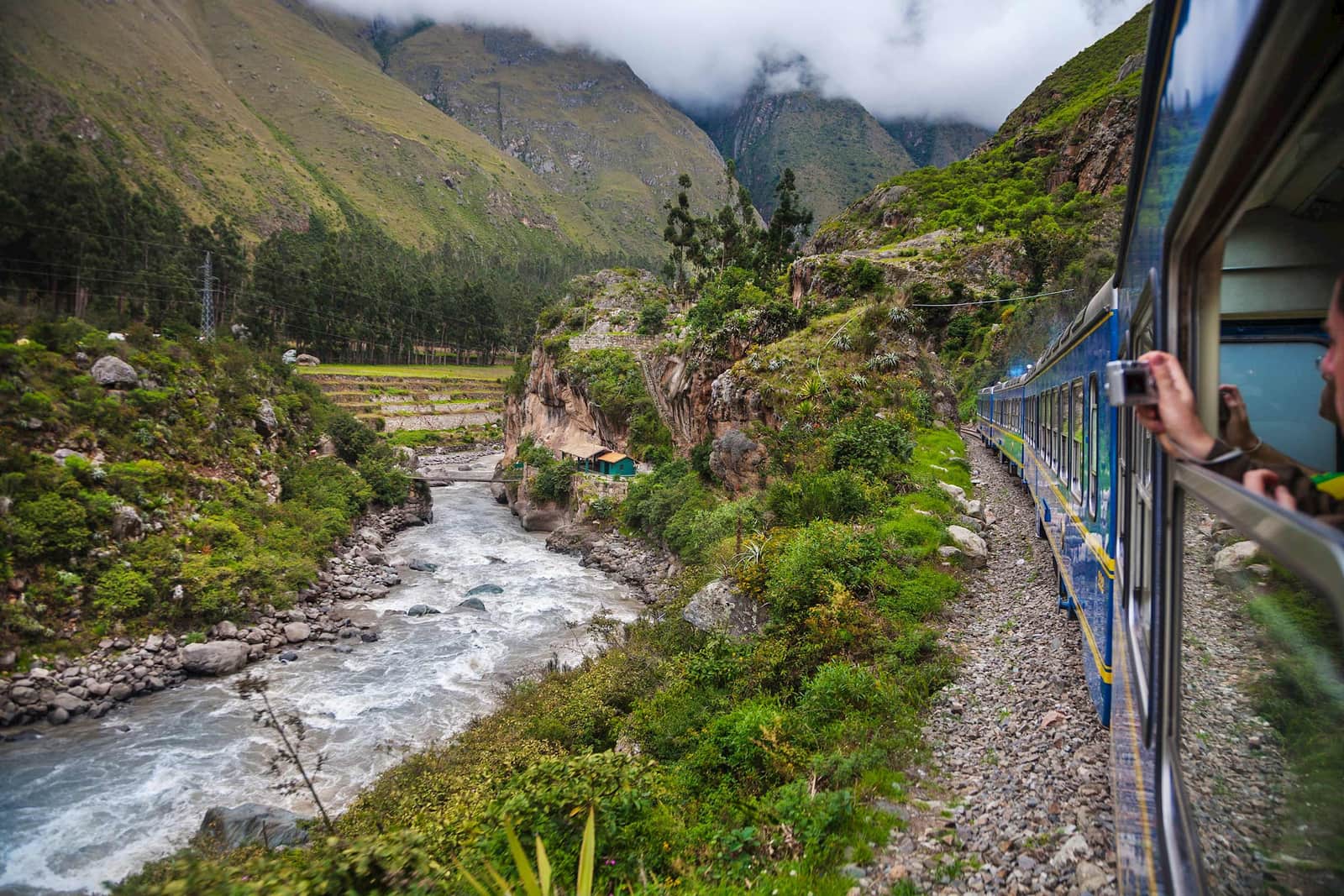 A train track along a river in Machu Picchu, Peru