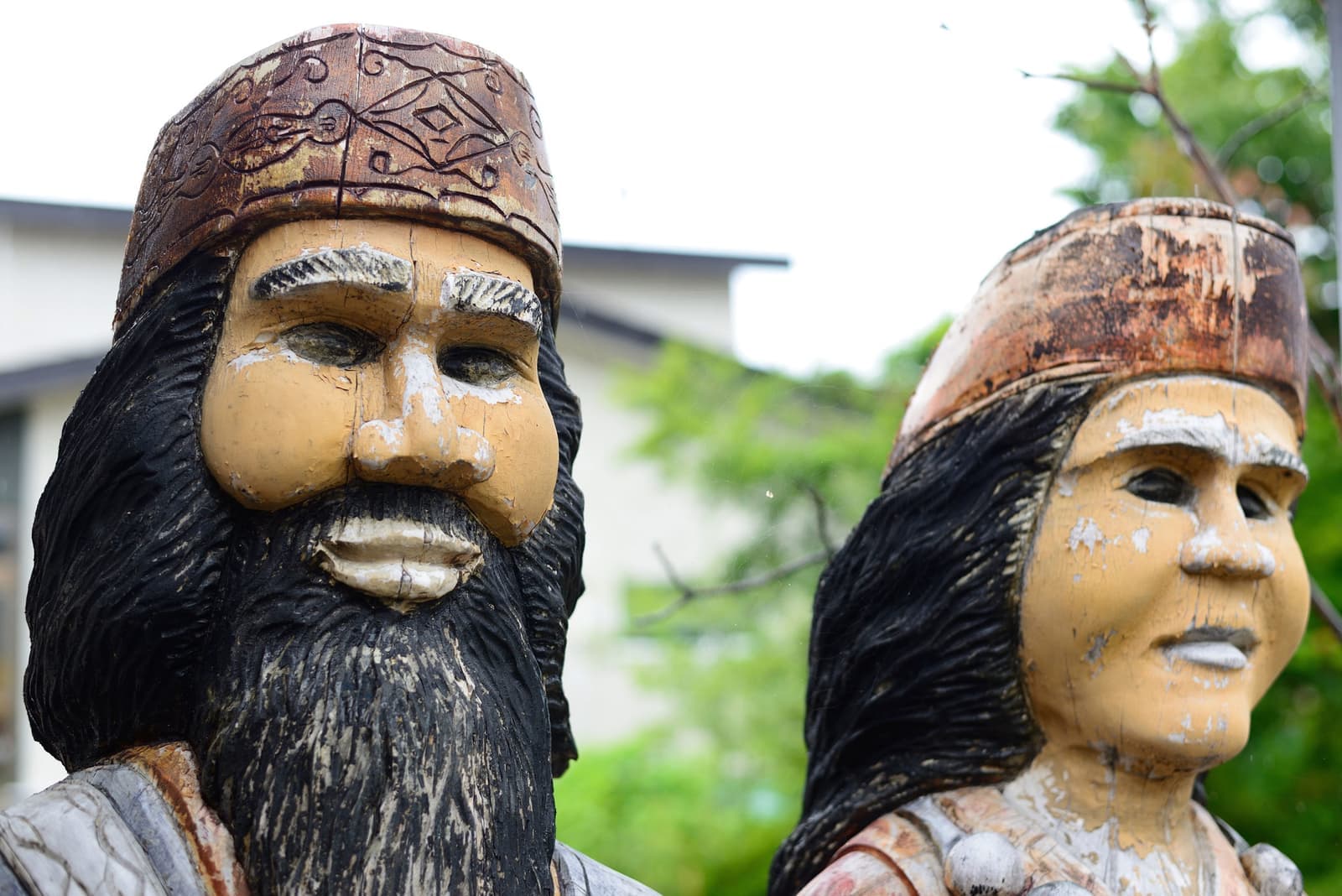 Two heads of Nipopo dolls, traditional guardians of the Ainu, Hokkaido, Japan