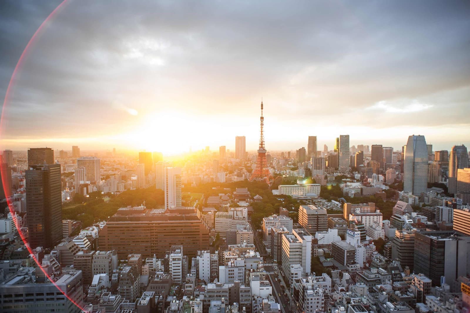 City skyline at sunset with Tokyo Tower and surrounding high rise buildings, Japan