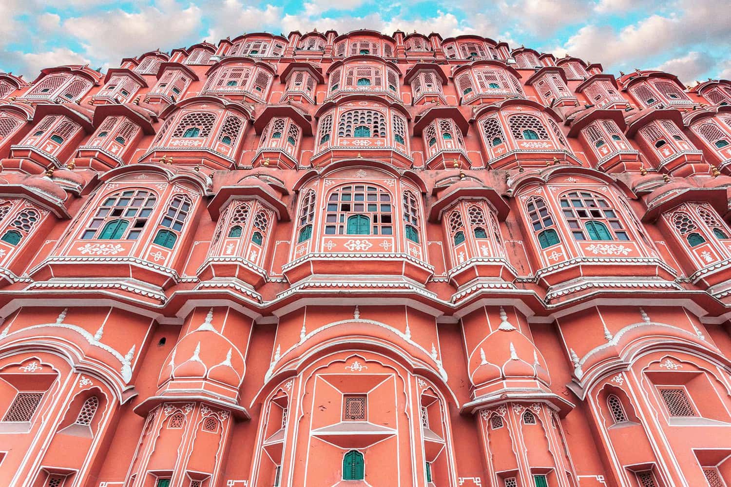 Pink sandstone palace featuring hundreds of ornate, honeycombed windows, Jaipur, India