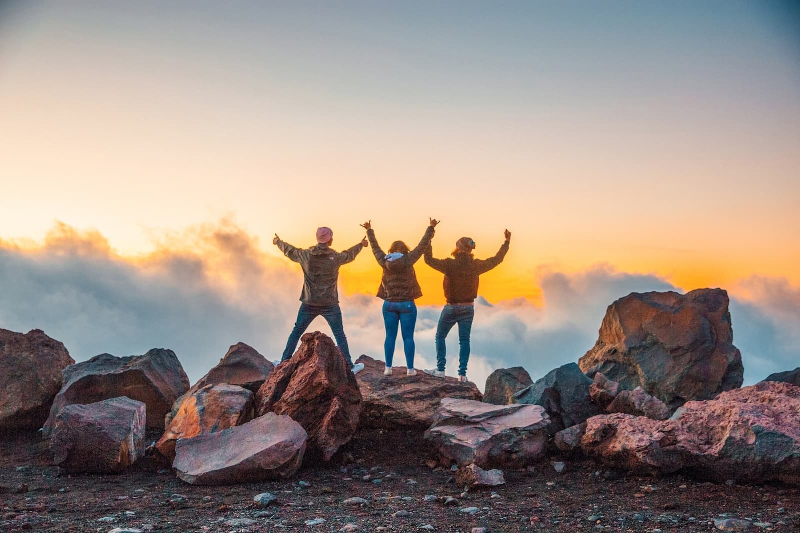 Travellers at the top of Mount Ruapehu during sunset in New Zealand