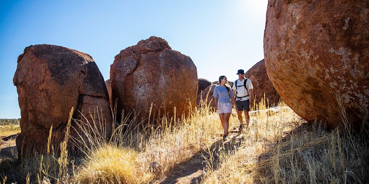 Couple Exploring Devil's Marbles Credit Tourism Nt And Helen Orr