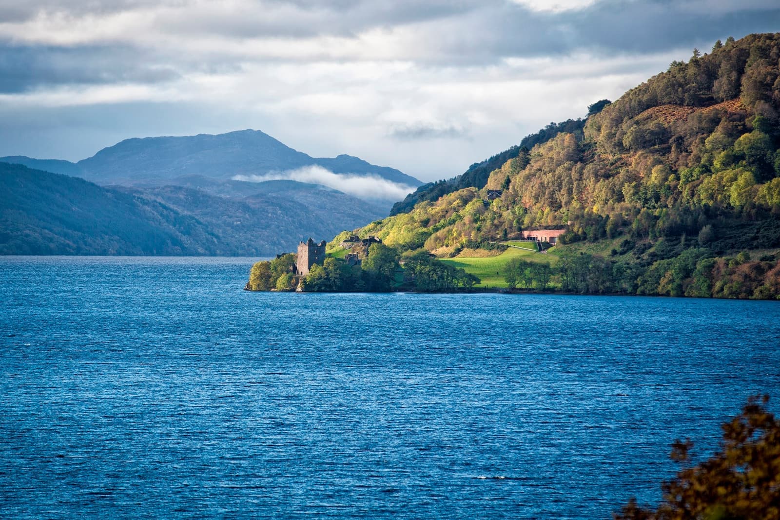 A coastal view of Urquhart Castle in Loch Ness