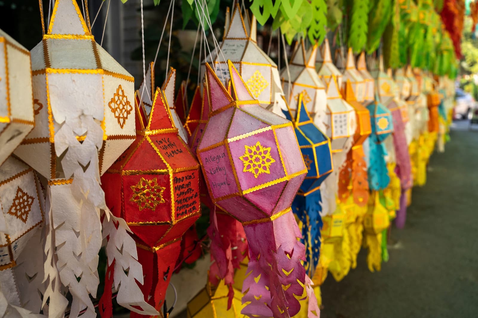 Colorful paper lanterns hanging in outdoor market, Chiang Mai, Thailand