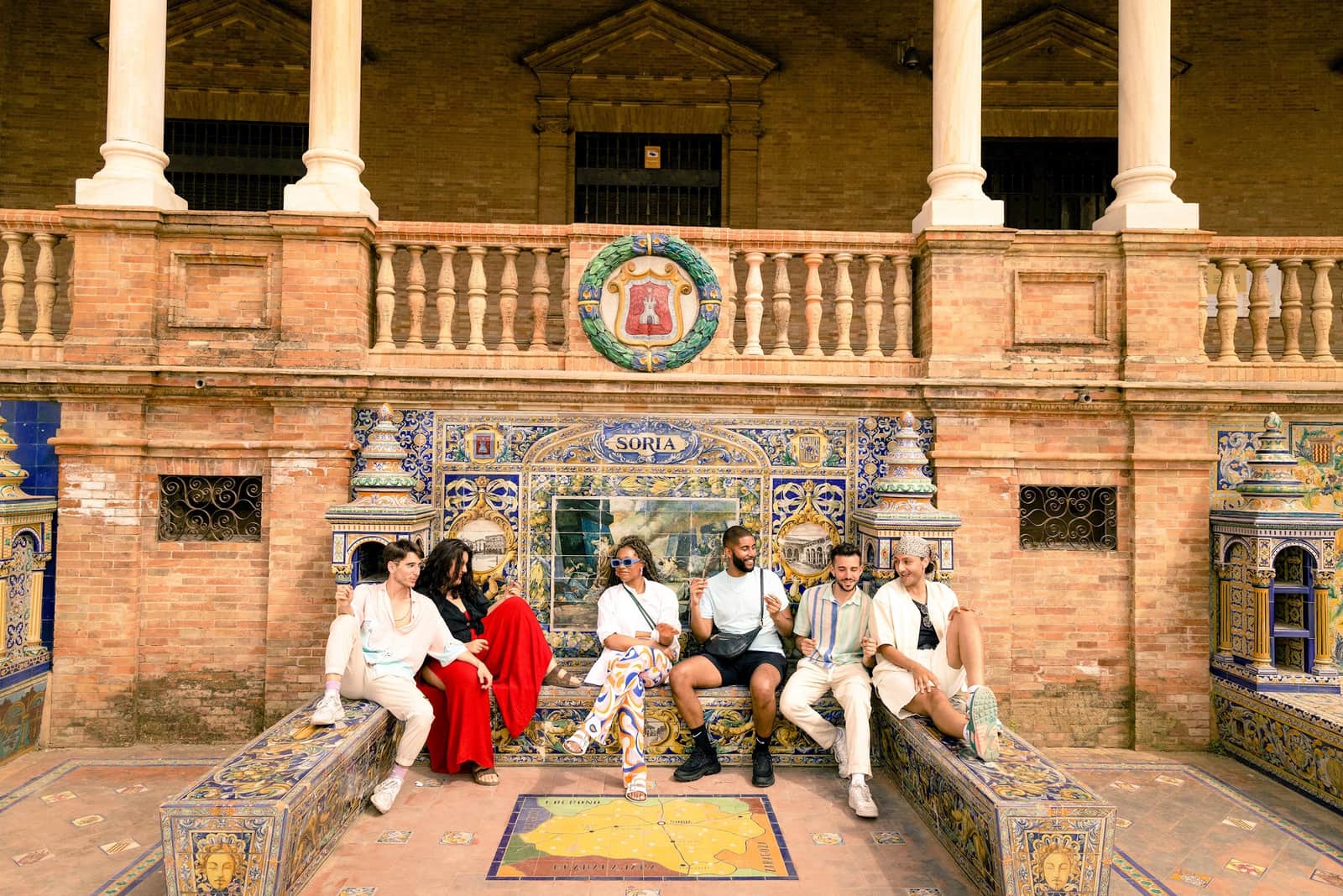 Traveller's sitting in Plaza De Seville, Spain