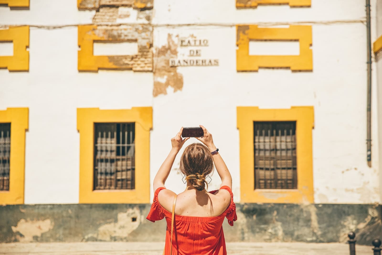 Traveller taking a photo of Patio de Banderas in Seville, Spain