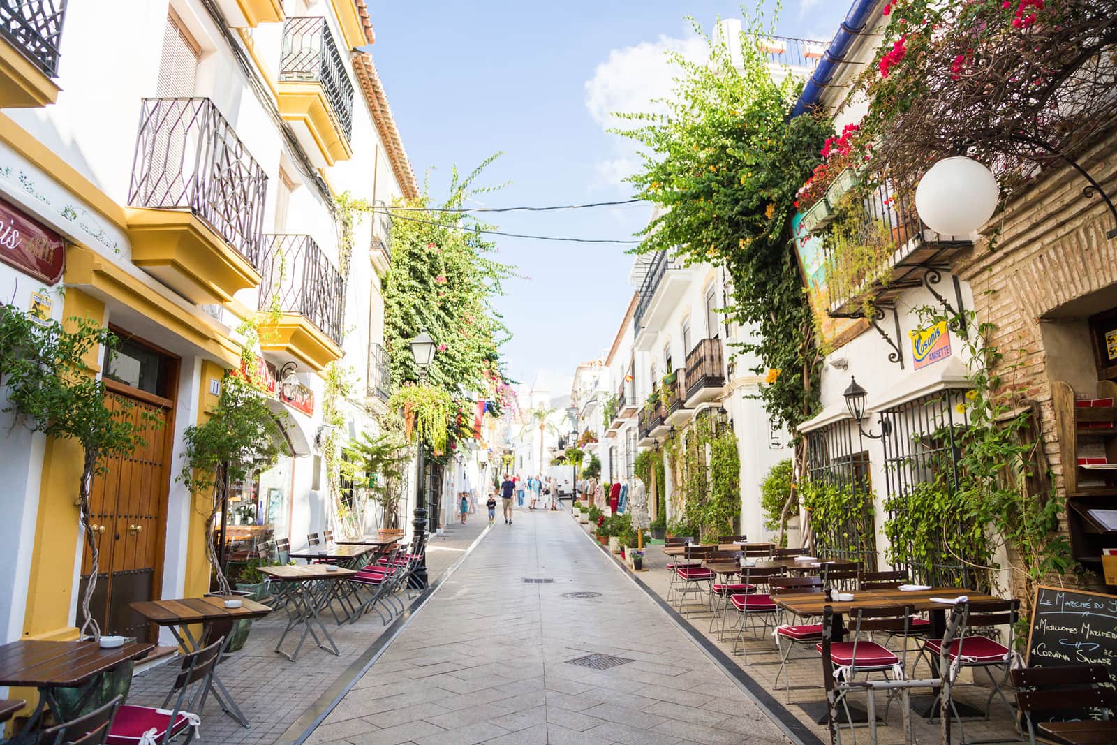 Pedestrian streets lined with outdoor cafe, balconies and greenery