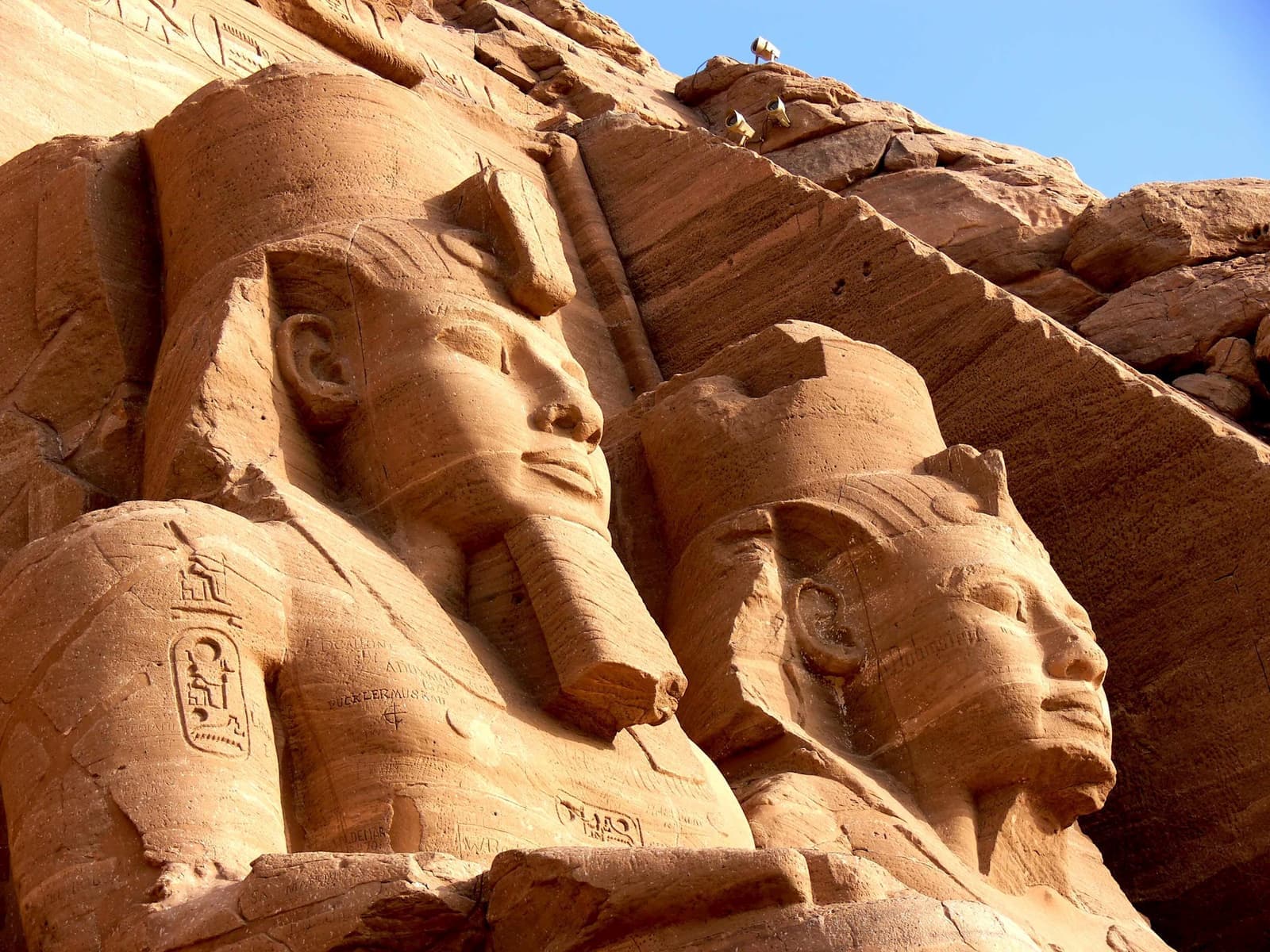 Colossal seated statues carved into rock facade, Abu Simbel, Egypt